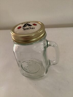 Hand embroidered top on one pint mason jar with handle